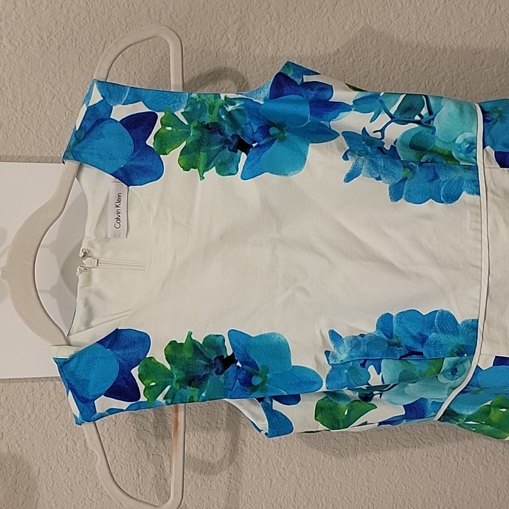 Calvin Klein white dress with blue floral embellishments, size 2